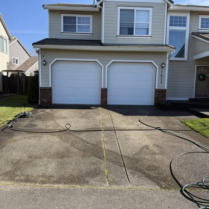 Driveway pressure washing in progress